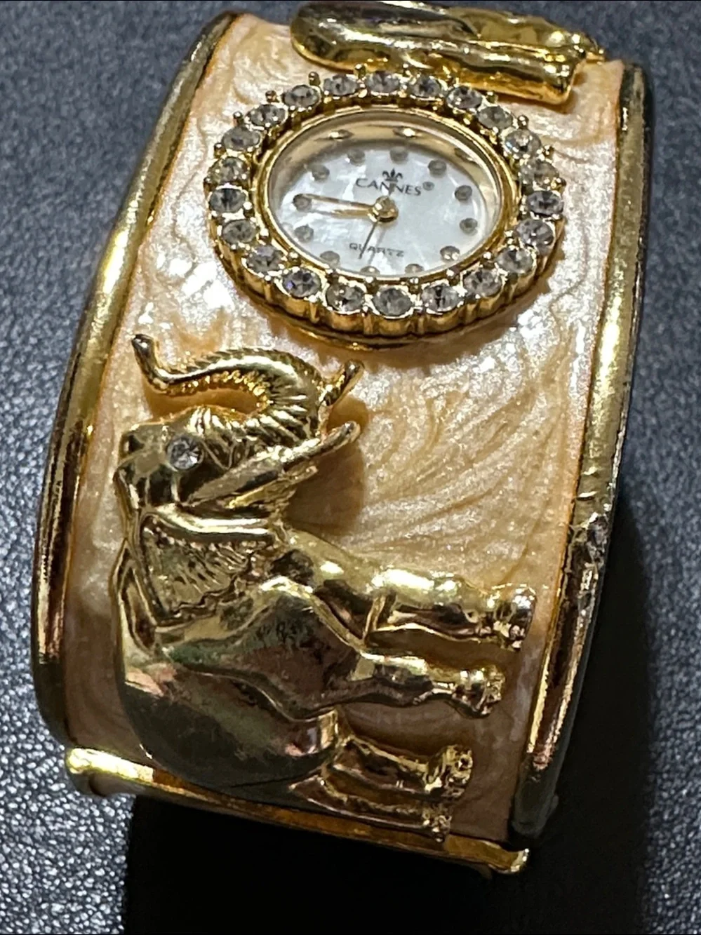 Cannes Gold Tone Elephant Hinged Enamel Clamper Bracelet Watch
